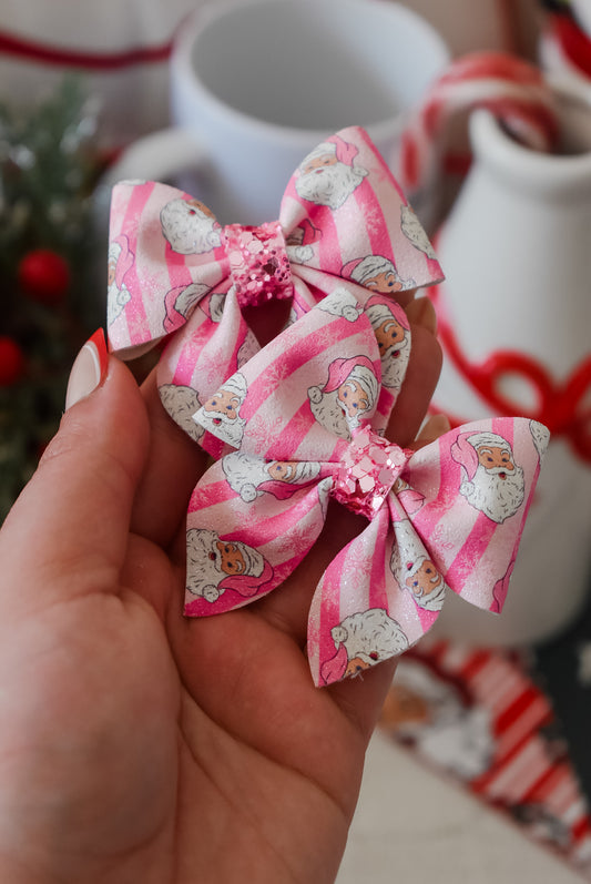 Pink pyjama Santa pigtail bows
