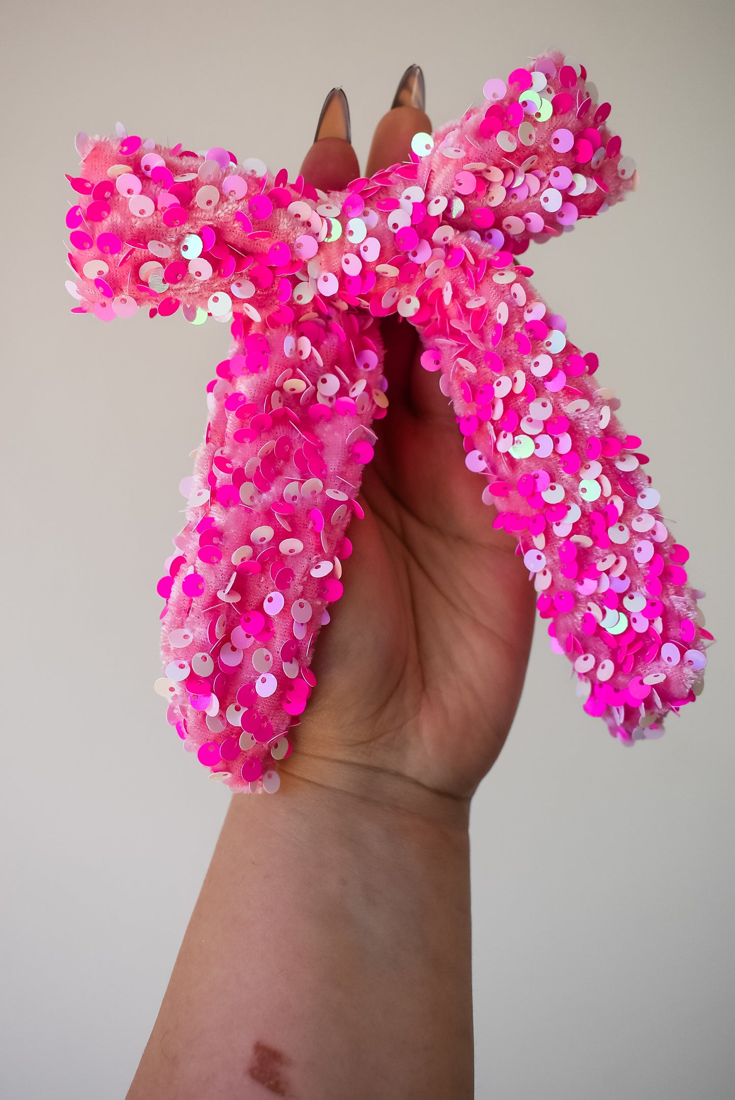 Sequin hand tied bow in colour barbie