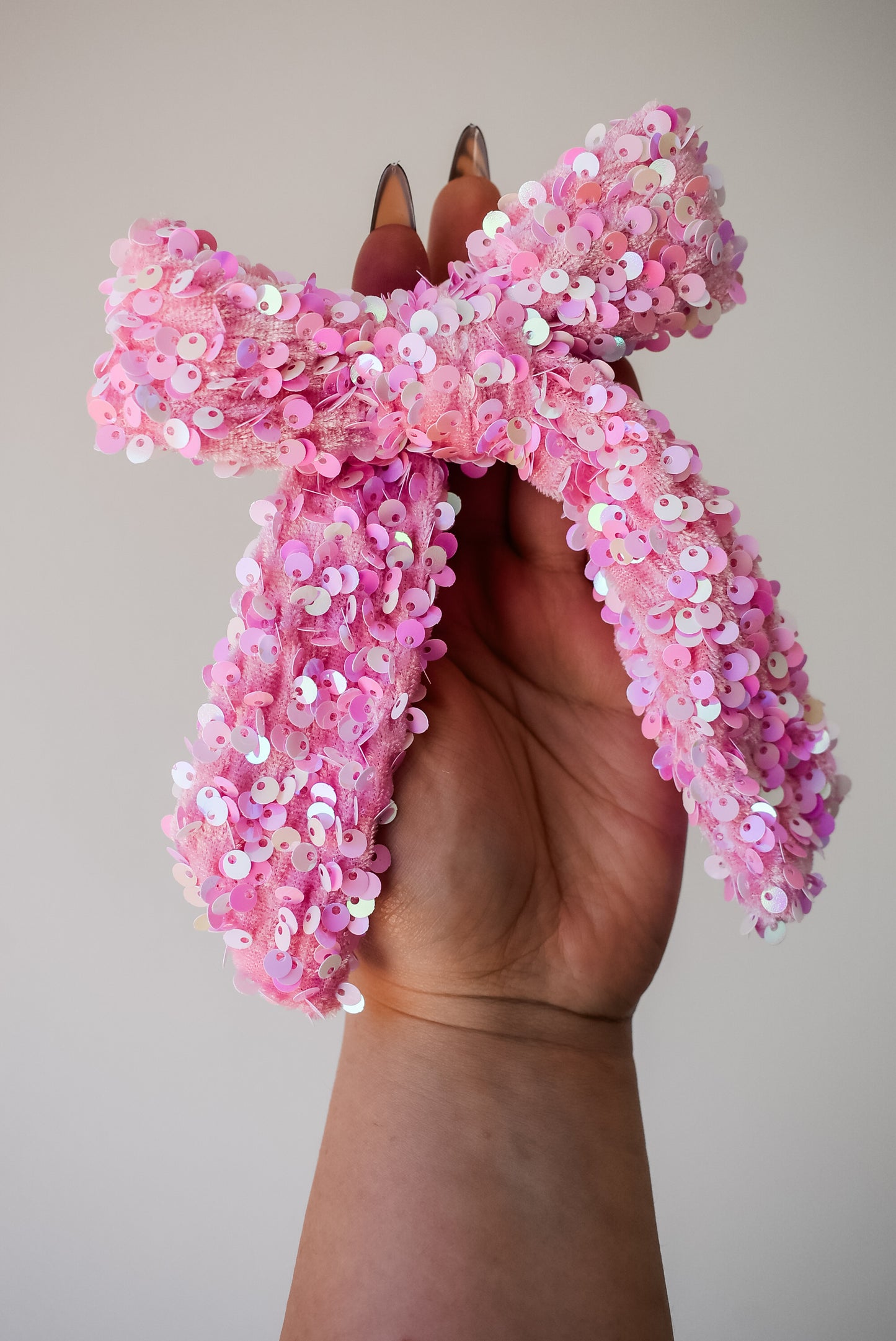 Sequin hand tied bow in colour Glinda