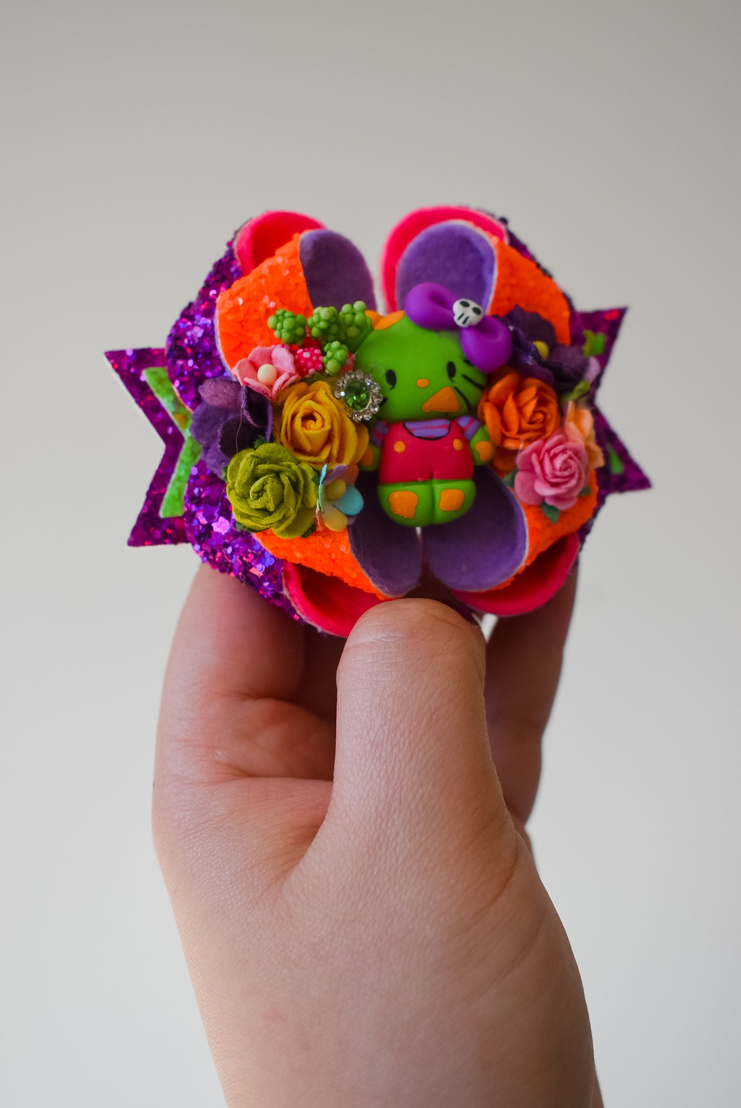 Electro zombie floral kitty clay bow