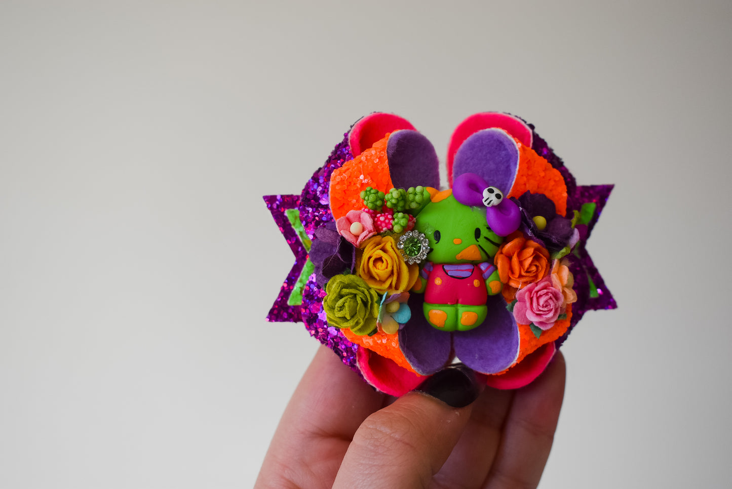 Electro zombie floral kitty clay bow