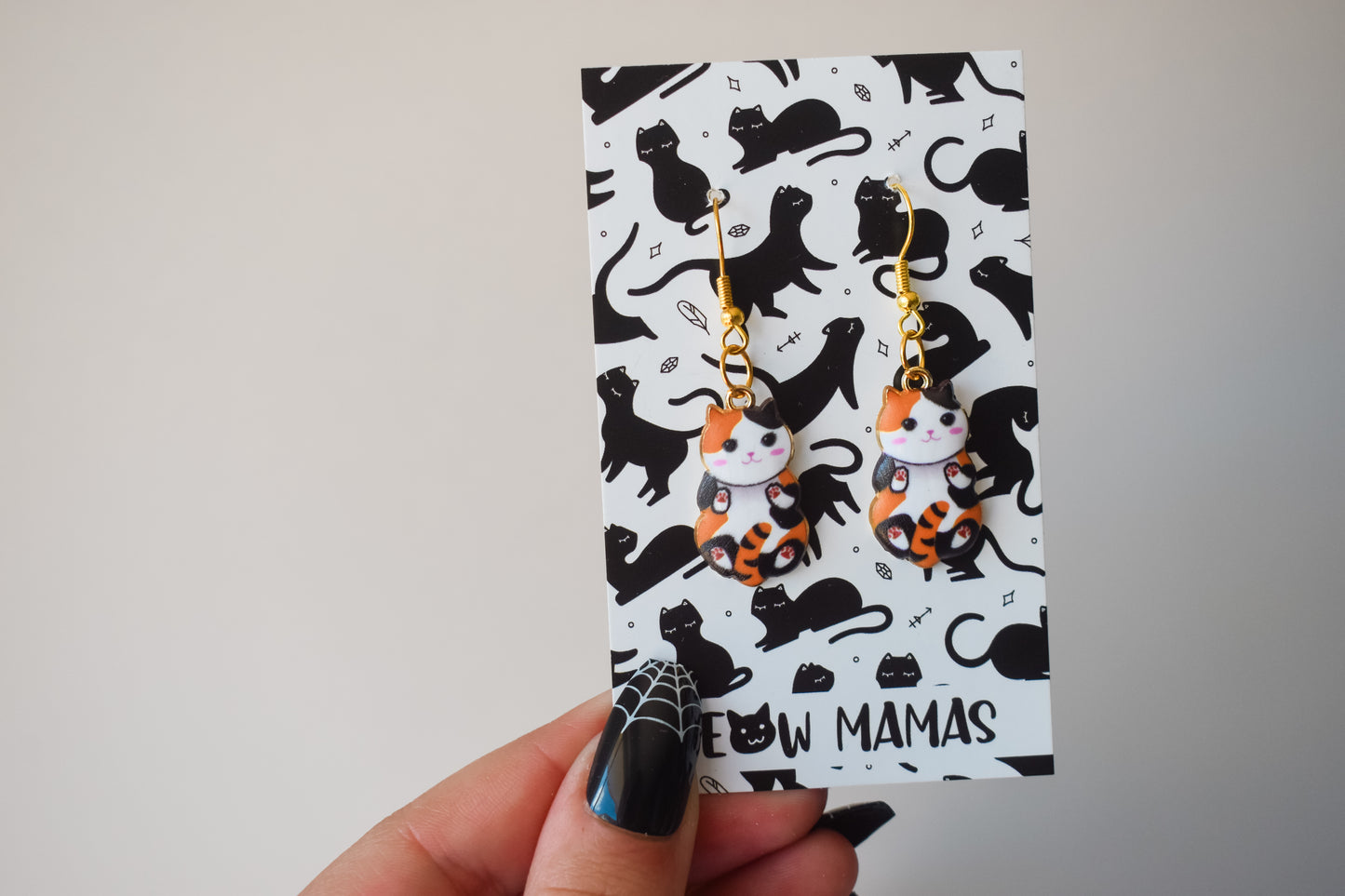 Kitty peets dangle earrings orange and black