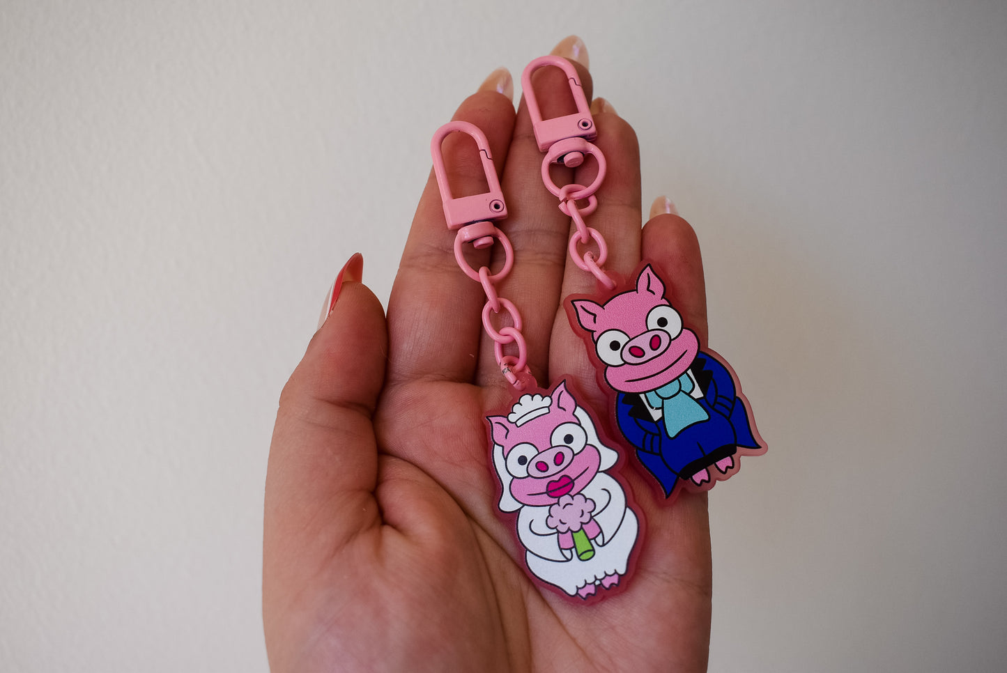 Pig cuffling his and hers keychain set