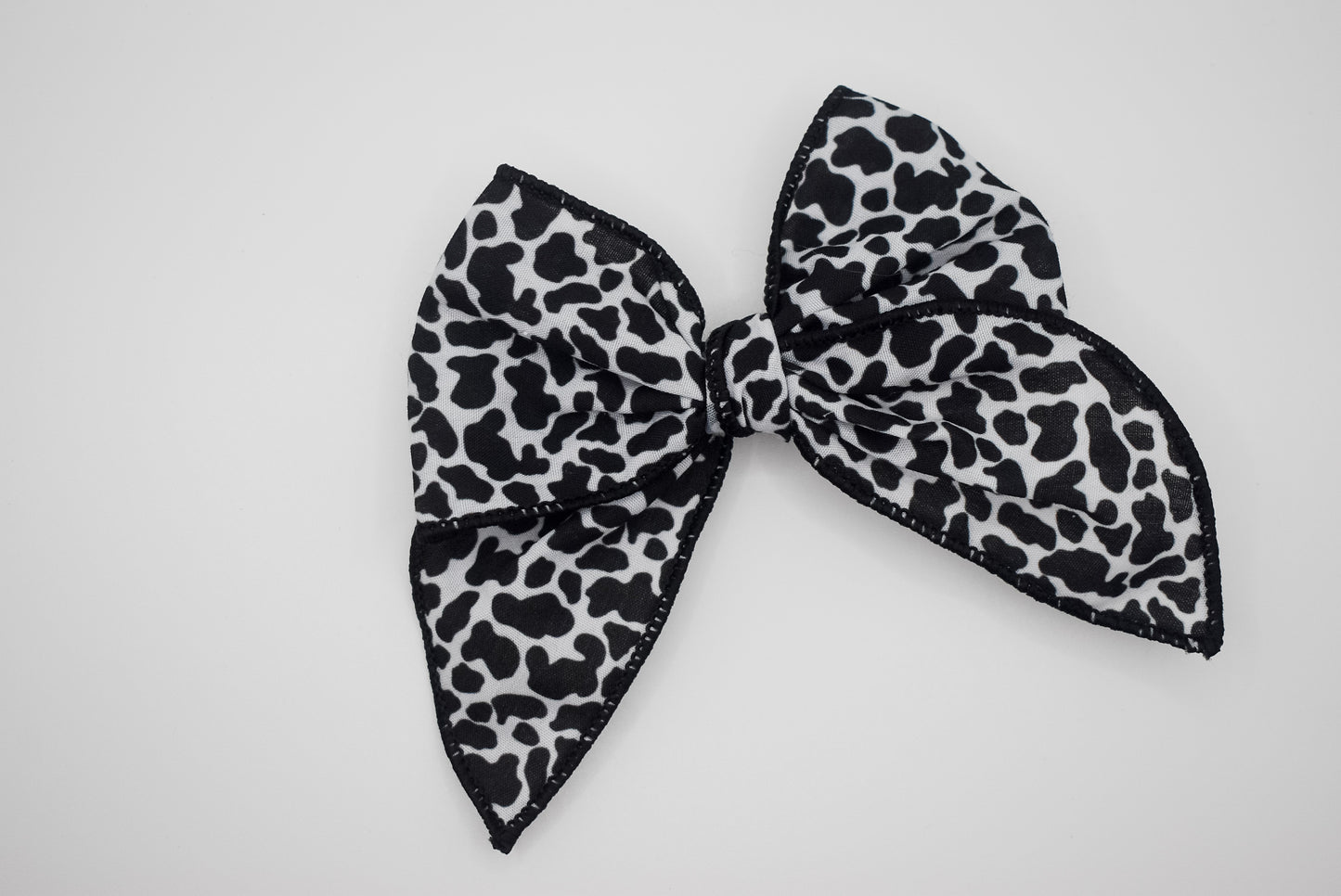 Cow print mini whimsical sailor bow