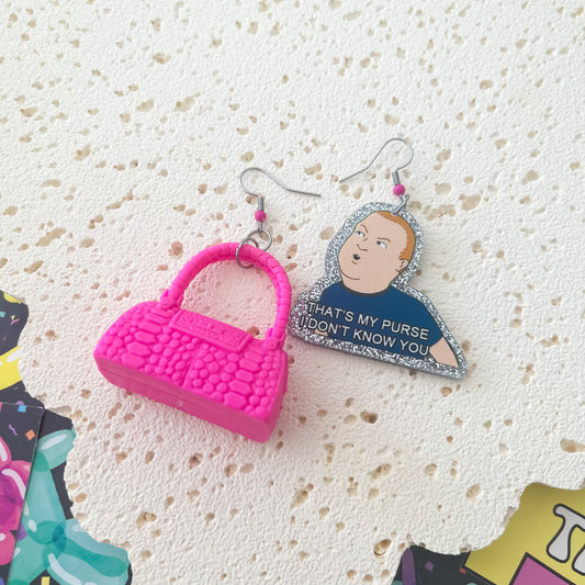 Thatโs my purse , I donโt know you earrings