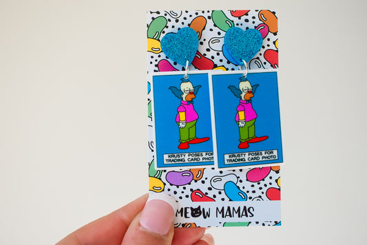 Krusty poses for playing card dangle earrings