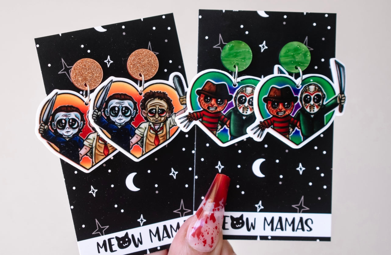 Slasher buddies in orange dangle earrings