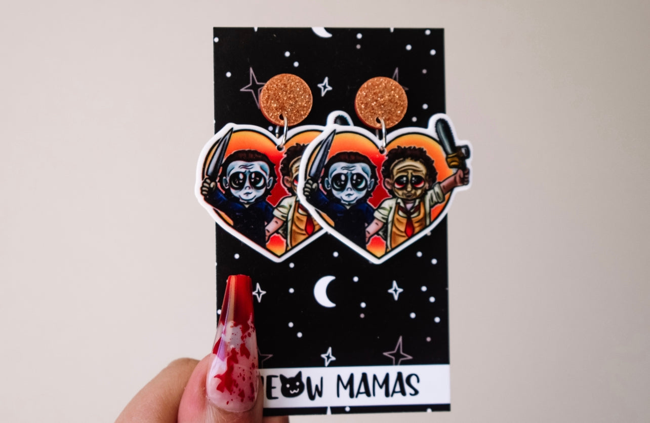 Slasher buddies in orange dangle earrings