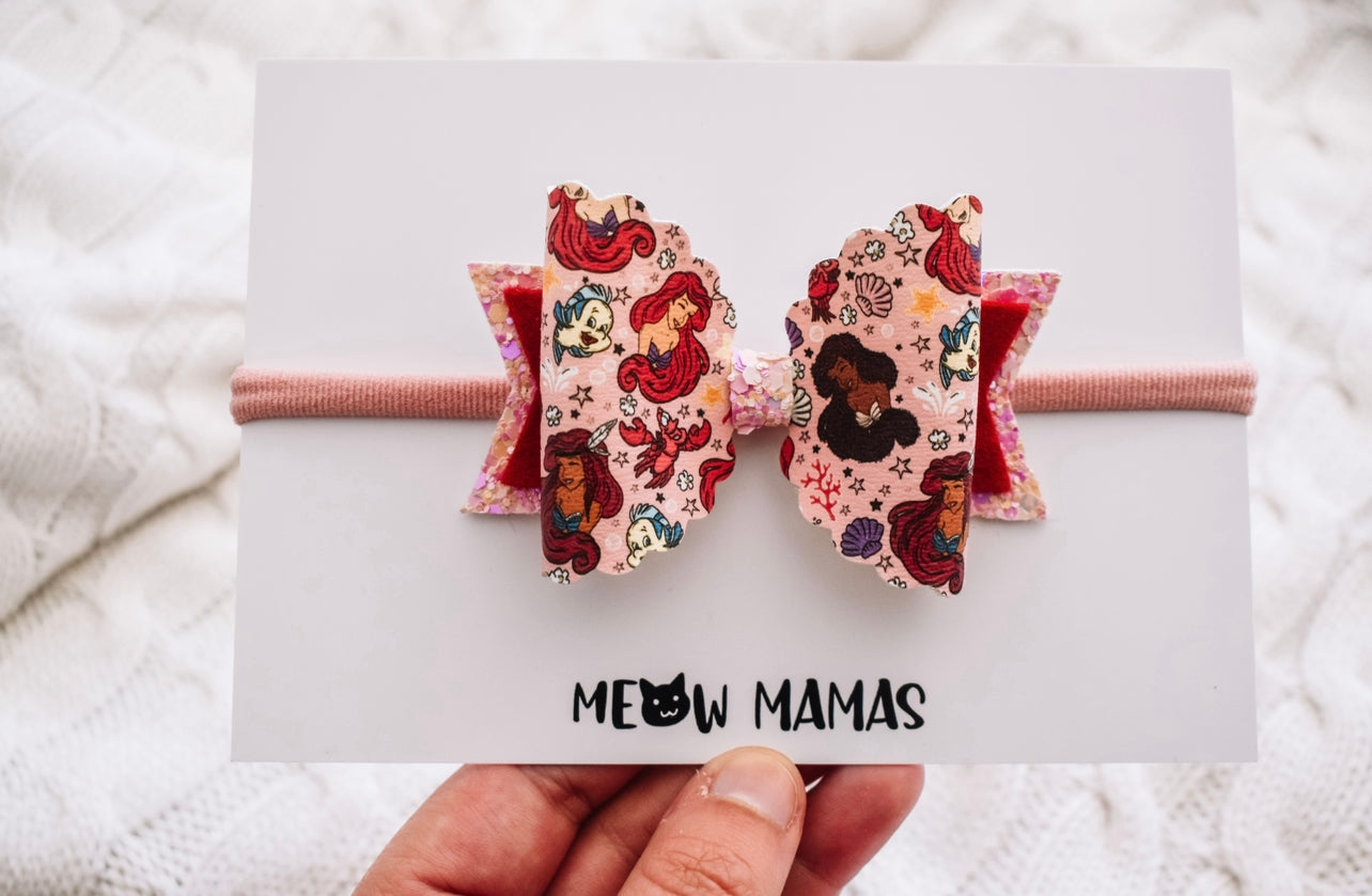 Inclusive mermaids pink bow