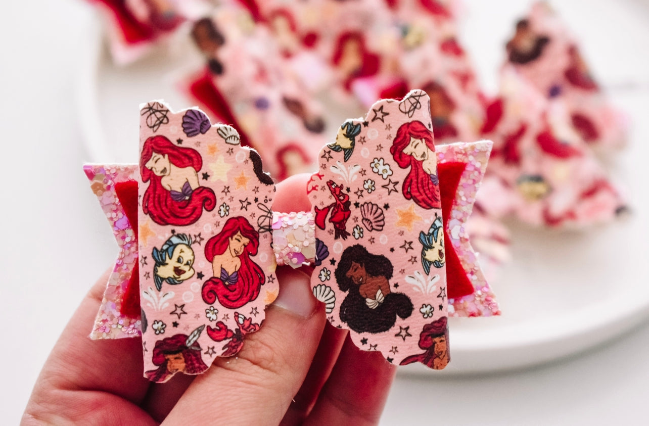 Inclusive mermaids pink bow