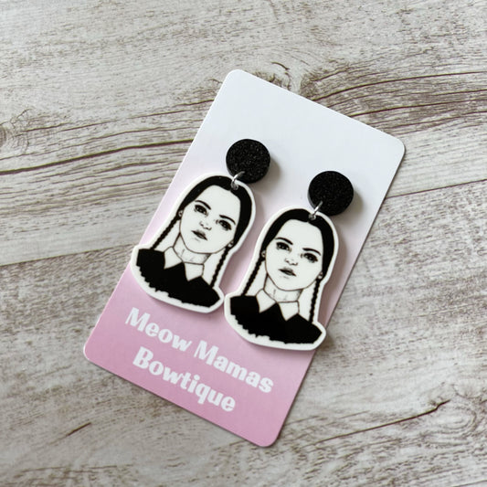 Wednesday Adams dangles