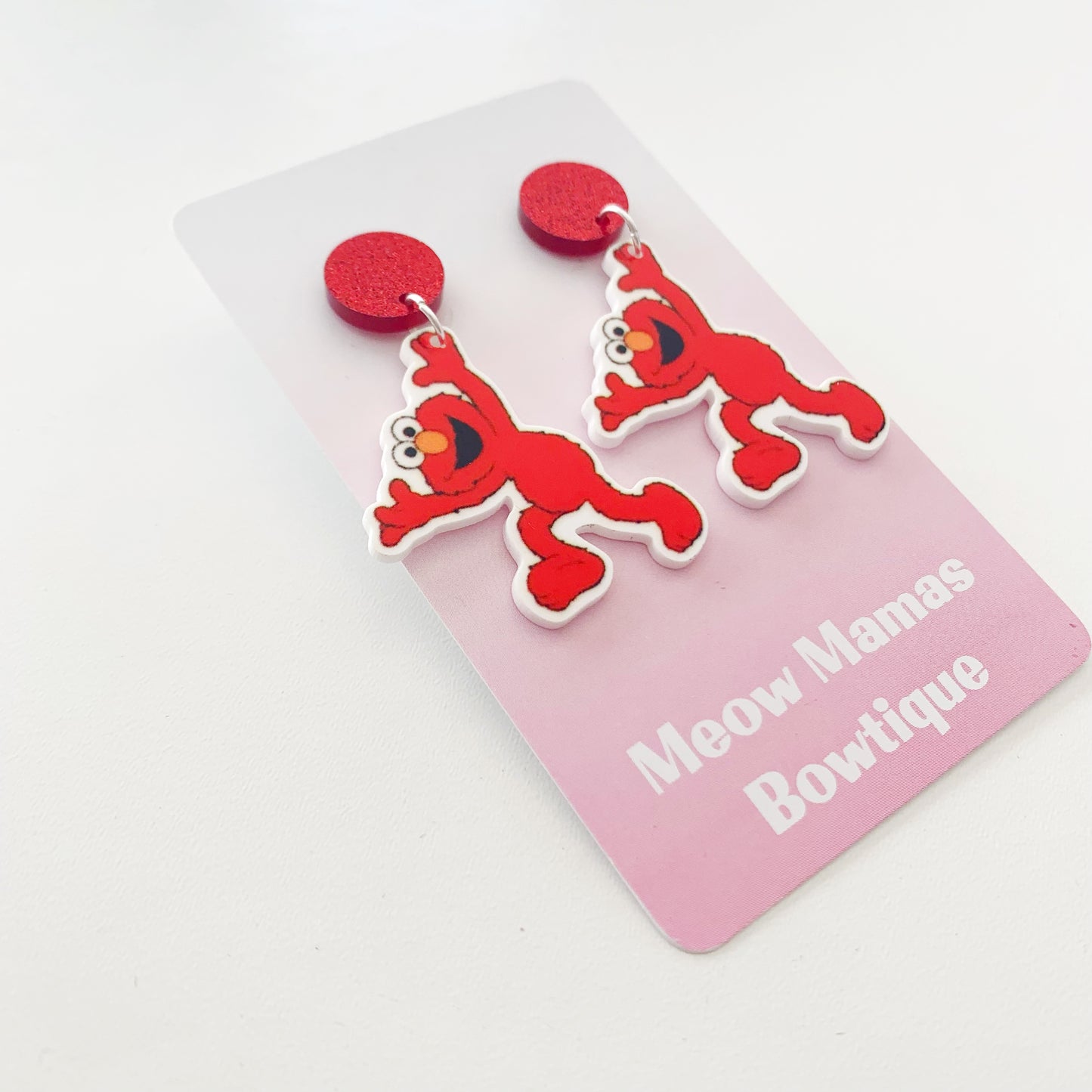 Elmo dangle earrings