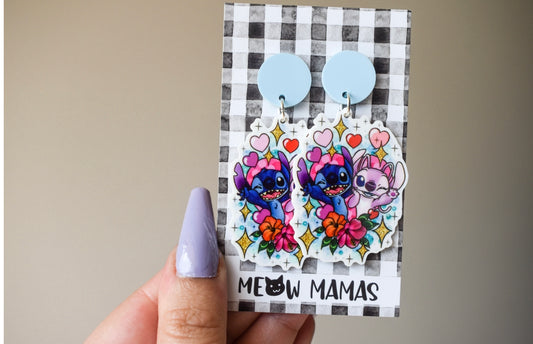 Alien pair dangle earrings