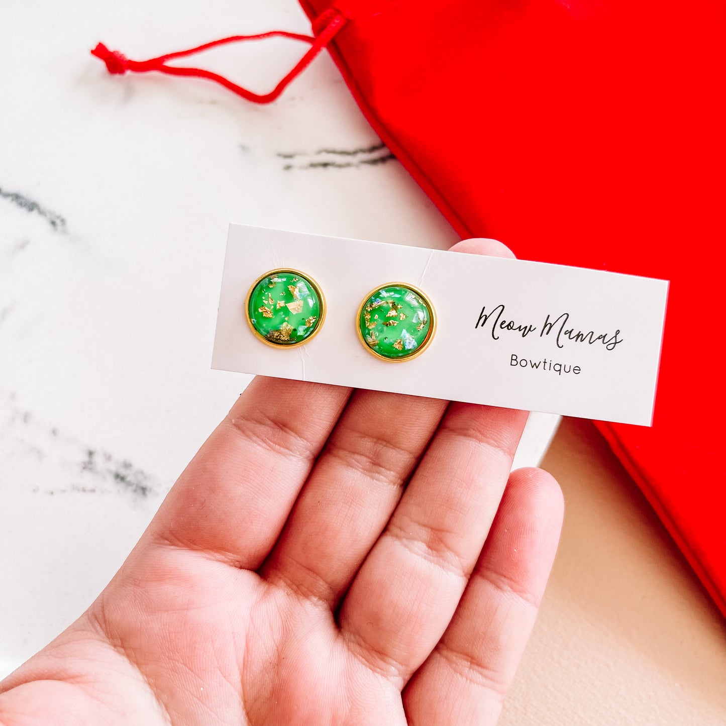 Green and gold studs