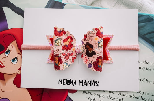 Inclusive mermaids pink bow